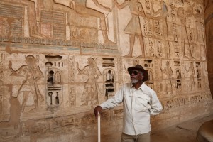 LUXOR, EGYPT - Morgan Freeman stands in front of a wall of hieroglyphs at the mortuary temple of Rameses III in Luxor, Egypt.  (photo credit: National Geographic Channels/Seth Nejame)